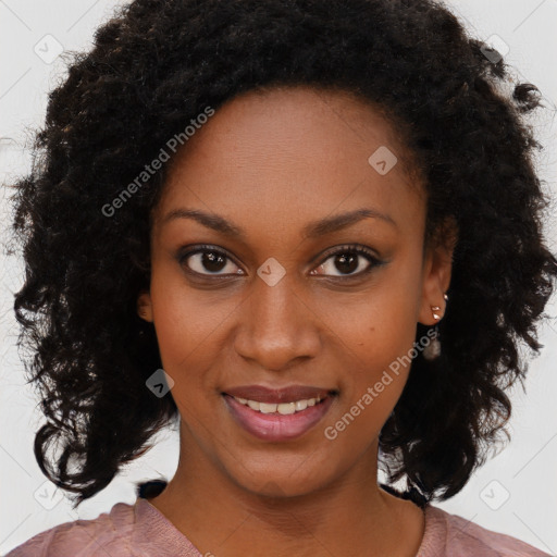 Joyful black young-adult female with medium  brown hair and brown eyes