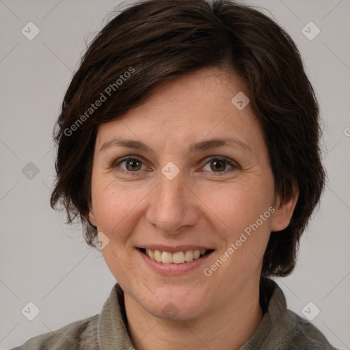 Joyful white adult female with medium  brown hair and brown eyes