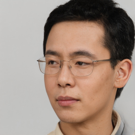 Neutral asian adult male with short  black hair and brown eyes