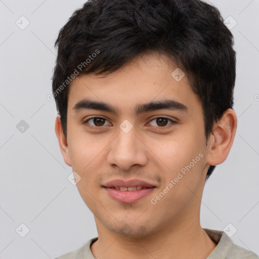 Joyful latino young-adult male with short  brown hair and brown eyes