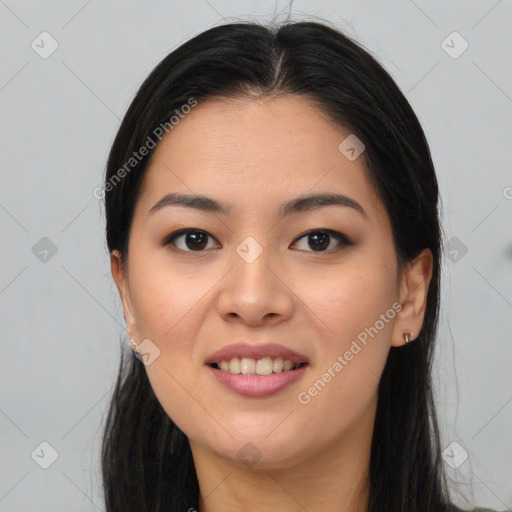 Joyful asian young-adult female with long  brown hair and brown eyes