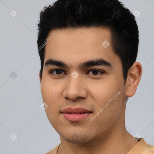 Joyful latino young-adult male with short  black hair and brown eyes