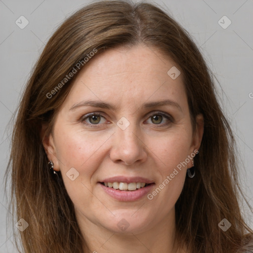 Joyful white adult female with long  brown hair and grey eyes