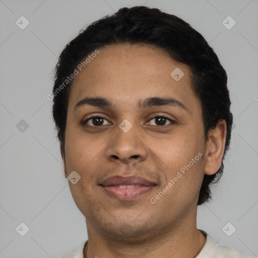 Joyful latino young-adult male with short  black hair and brown eyes