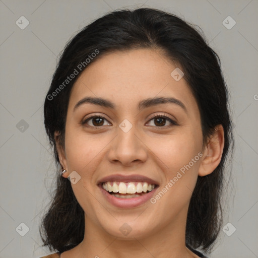 Joyful latino young-adult female with medium  brown hair and brown eyes