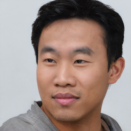 Neutral asian young-adult male with short  black hair and brown eyes