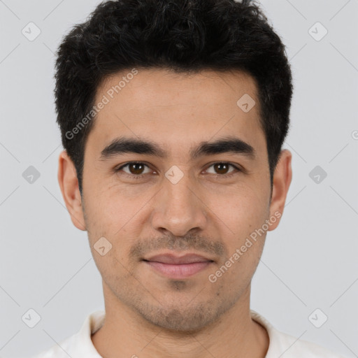 Joyful white young-adult male with short  black hair and brown eyes