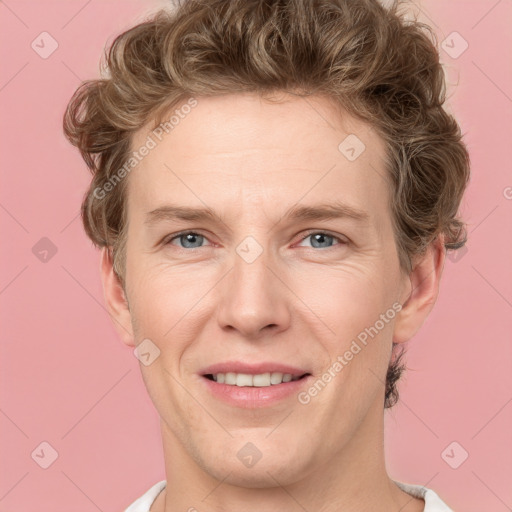 Joyful white adult male with short  brown hair and grey eyes