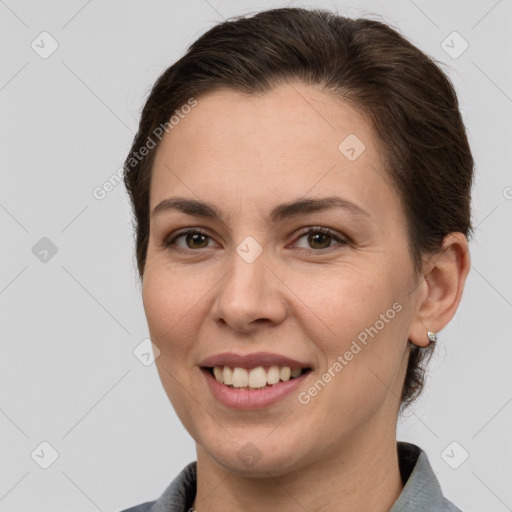 Joyful white young-adult female with short  brown hair and brown eyes