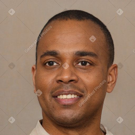 Joyful black young-adult male with short  black hair and brown eyes