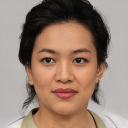 Joyful asian young-adult female with medium  brown hair and brown eyes