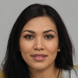 Joyful latino young-adult female with long  brown hair and brown eyes