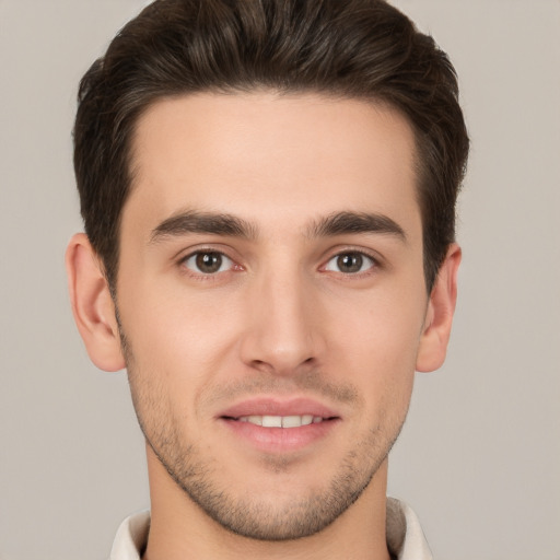 Joyful white young-adult male with short  brown hair and brown eyes