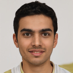 Joyful latino young-adult male with short  black hair and brown eyes