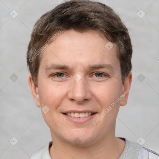 Joyful white adult male with short  brown hair and grey eyes