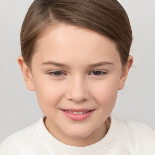 Joyful white child female with short  brown hair and brown eyes