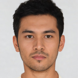 Neutral asian young-adult male with short  brown hair and brown eyes