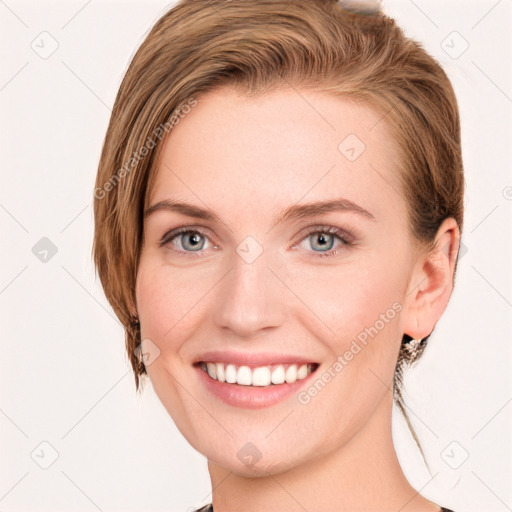 Joyful white young-adult female with short  brown hair and grey eyes