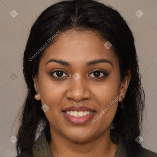 Joyful black young-adult female with long  brown hair and brown eyes