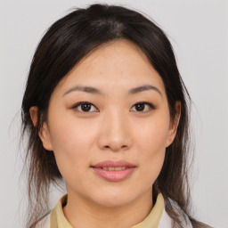 Joyful asian young-adult female with medium  brown hair and brown eyes