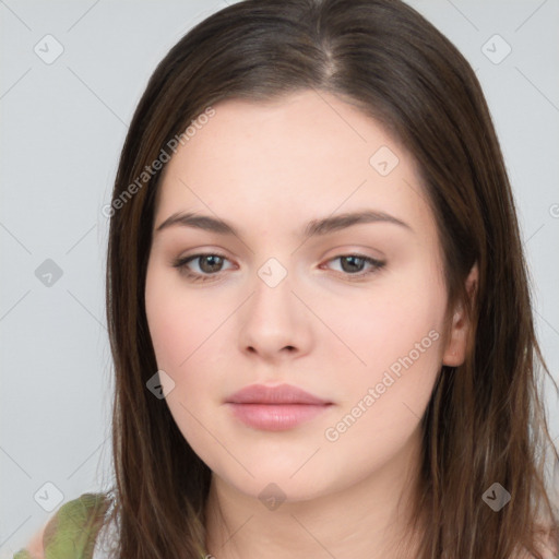 Neutral white young-adult female with long  brown hair and brown eyes