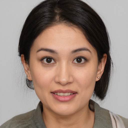 Joyful white young-adult female with medium  brown hair and brown eyes