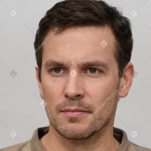 Neutral white young-adult male with short  brown hair and grey eyes