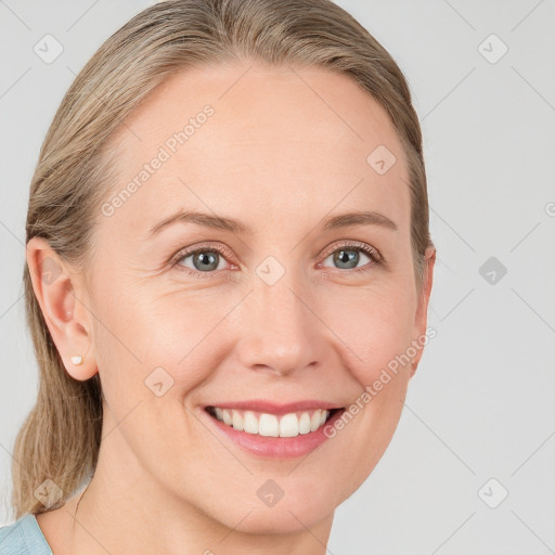 Joyful white young-adult female with medium  brown hair and blue eyes