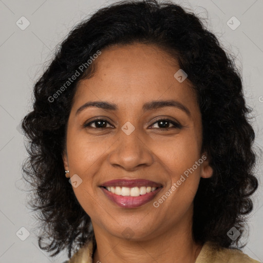 Joyful black young-adult female with long  brown hair and brown eyes