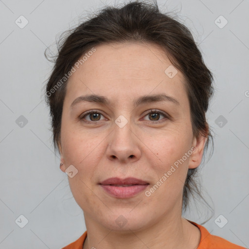 Joyful white adult female with short  brown hair and brown eyes