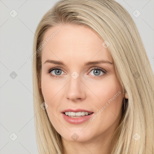 Joyful white young-adult female with long  brown hair and blue eyes