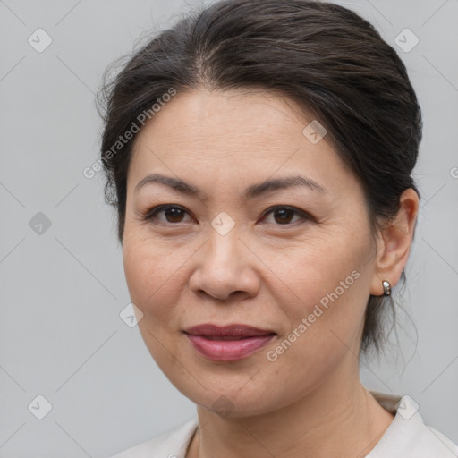 Joyful white adult female with medium  brown hair and brown eyes