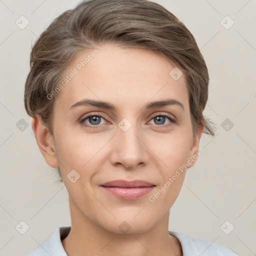 Joyful white young-adult female with short  brown hair and grey eyes