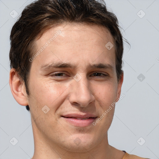 Joyful white adult male with short  brown hair and grey eyes