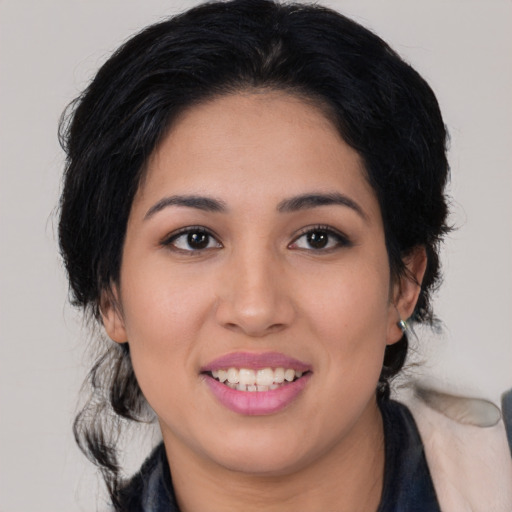 Joyful asian young-adult female with medium  black hair and brown eyes
