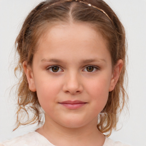 Joyful white child female with medium  brown hair and brown eyes