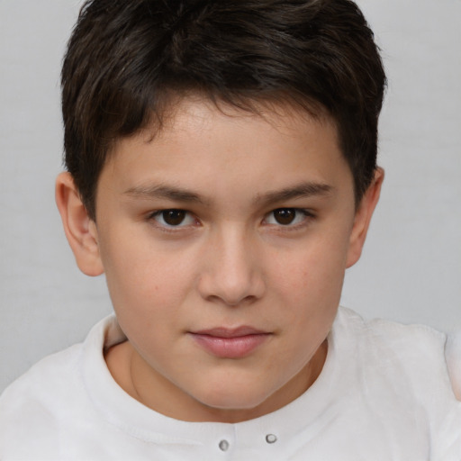 Joyful white child male with short  brown hair and brown eyes