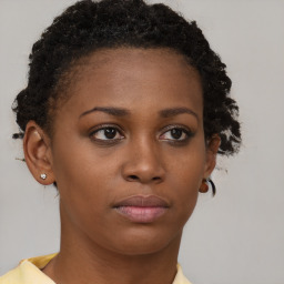 Neutral black young-adult female with short  brown hair and brown eyes