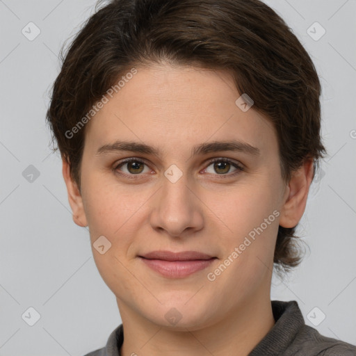 Joyful white young-adult female with short  brown hair and grey eyes