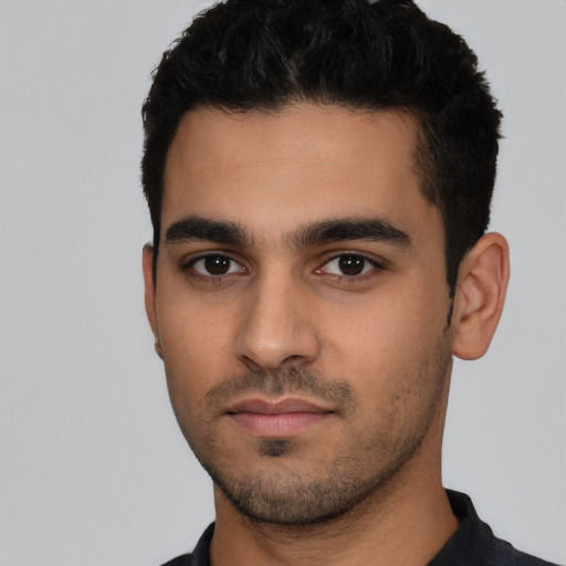 Neutral latino young-adult male with short  black hair and brown eyes