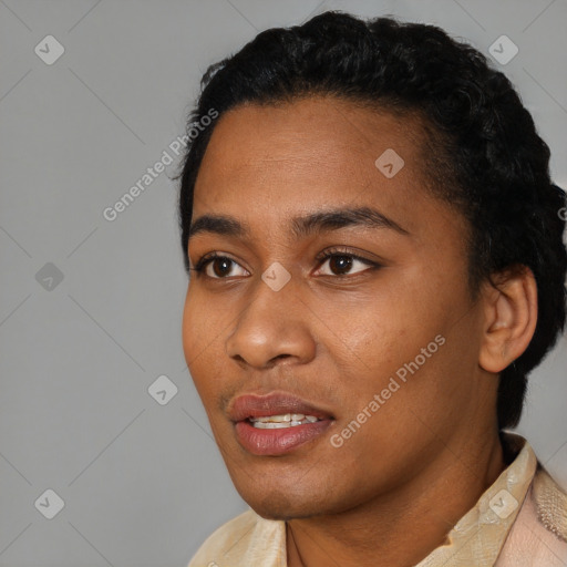 Joyful black young-adult female with short  black hair and brown eyes