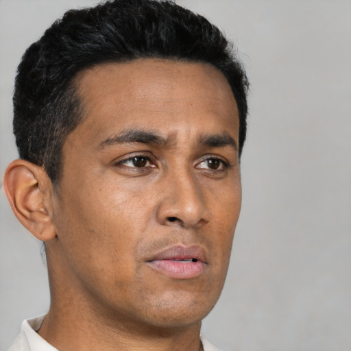 Neutral latino young-adult male with short  black hair and brown eyes