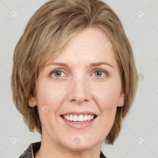 Joyful white adult female with medium  brown hair and blue eyes