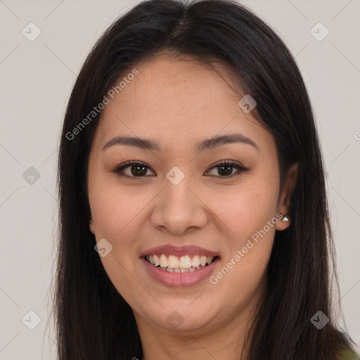 Joyful latino young-adult female with long  brown hair and brown eyes