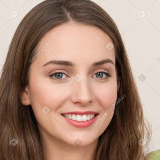 Joyful white young-adult female with long  brown hair and green eyes