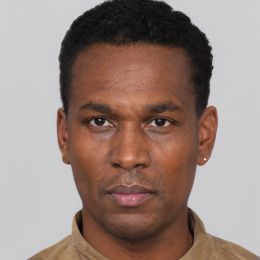 Neutral black adult male with short  black hair and brown eyes