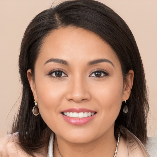 Joyful white young-adult female with long  brown hair and brown eyes