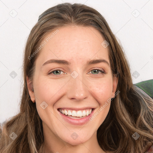 Joyful white young-adult female with long  brown hair and green eyes