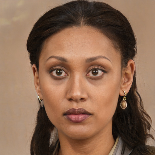 Neutral latino adult female with long  brown hair and brown eyes