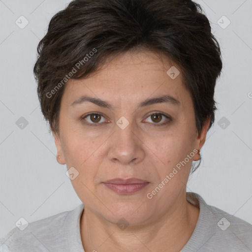 Joyful white adult female with short  brown hair and brown eyes